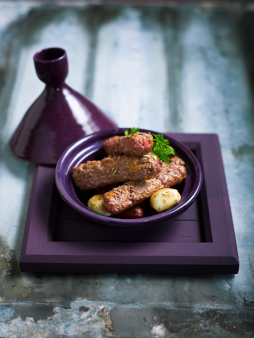 Tajine of sausages with minced meat