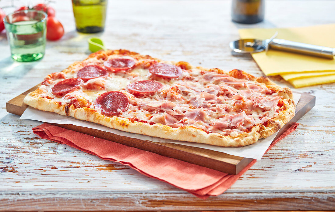 Pizza with ham and salami