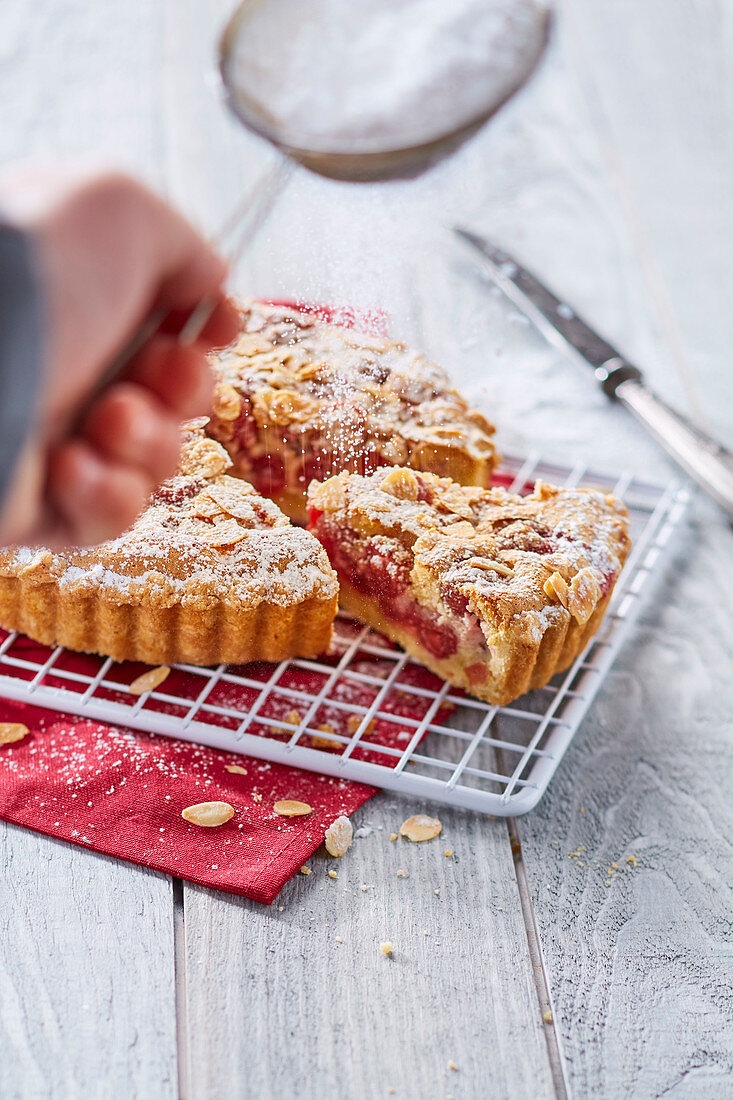 Cherry pie with almonds and icing sugar