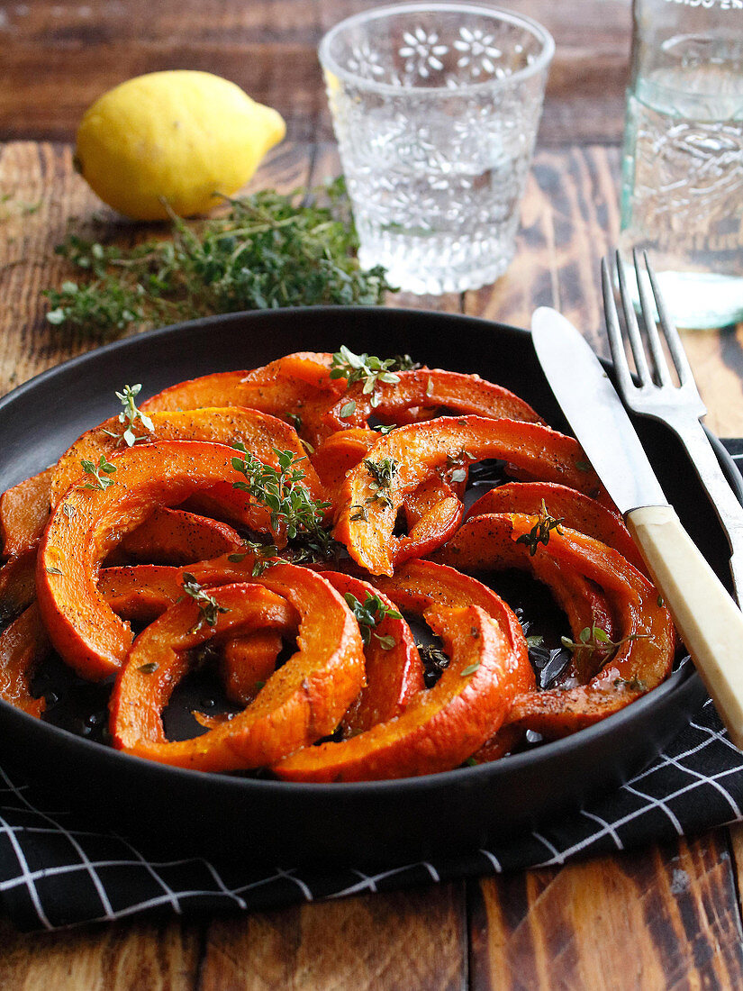 Sliced pumpkin roasted with honey,thyme and lemons