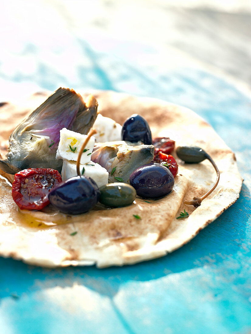 Pitta bread with artichokes,dried tomatoes,feta and olives