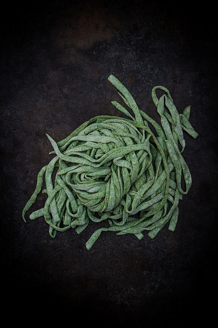 Uncooked fresh spinach pasta