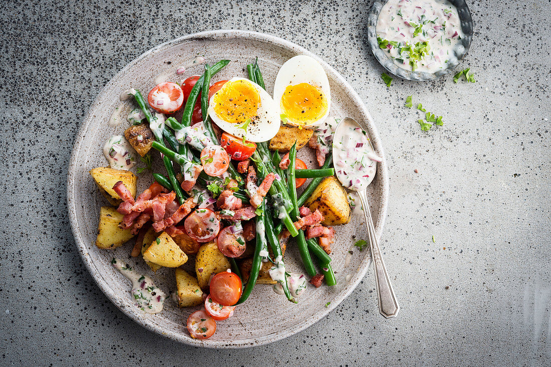 Mixed salad, potatoes, green beans, cherry tomatoes and hard-boiled eggs
