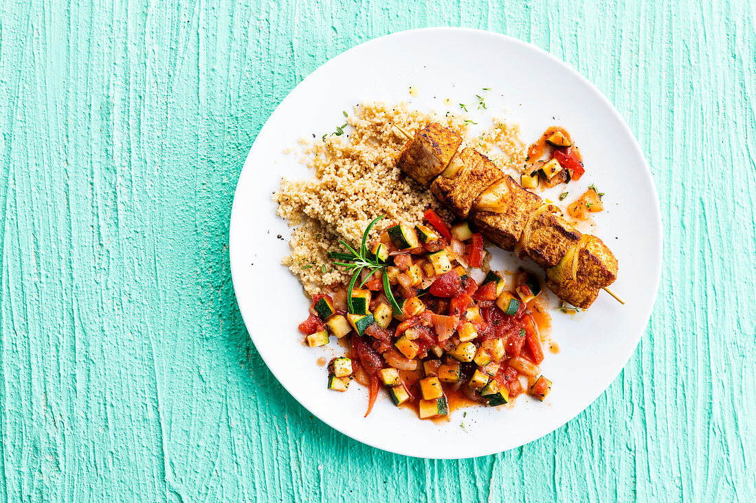 Pork skewers with satay, semolina and ratatouille