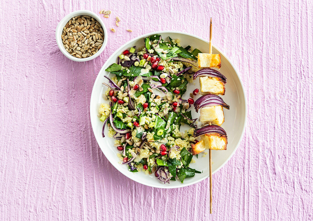 Semolina with red onions and fresh spinach, haloumi skewer