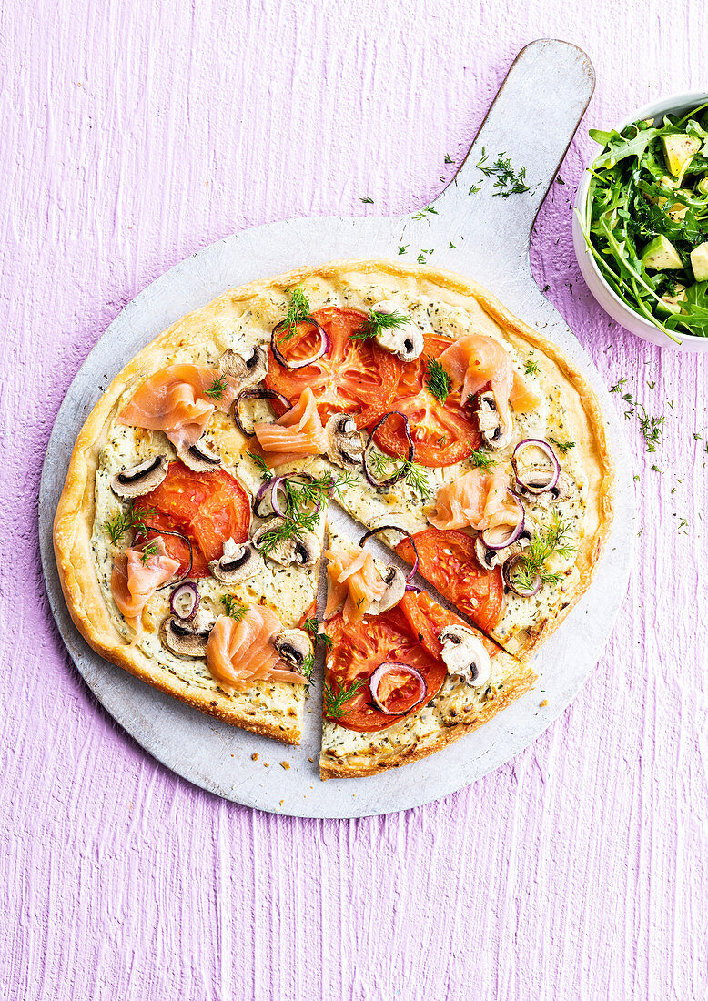 Cheese and herb cheese pizza with smoked salmon and tomatoes