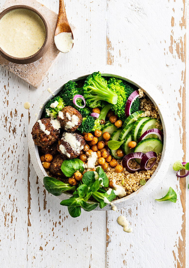 Bowl of quinoa with falafels, broccoli and crispy chickpeas