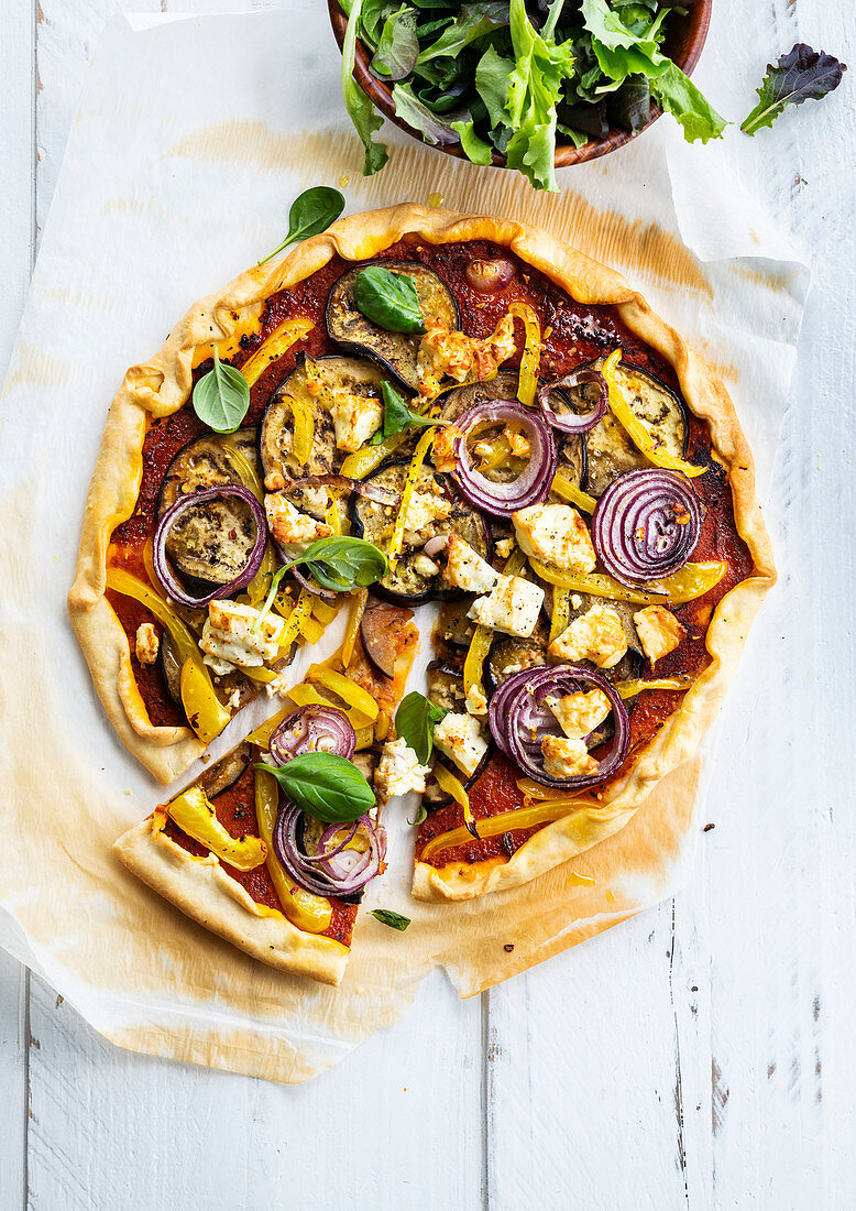 Pizza with eggplant, chicken and red onions