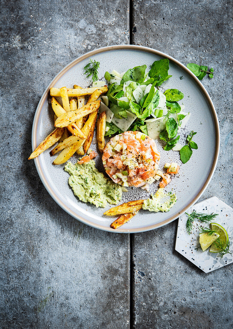 Salmon tartar with avocado mayonnaise and french fries