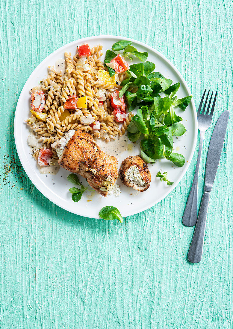 Turkey roll stuffed with fresh cheese and herbs, paprika pasta