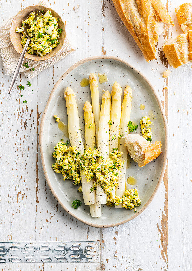 White asparagus Flemish style and scrambled eggs with herbs