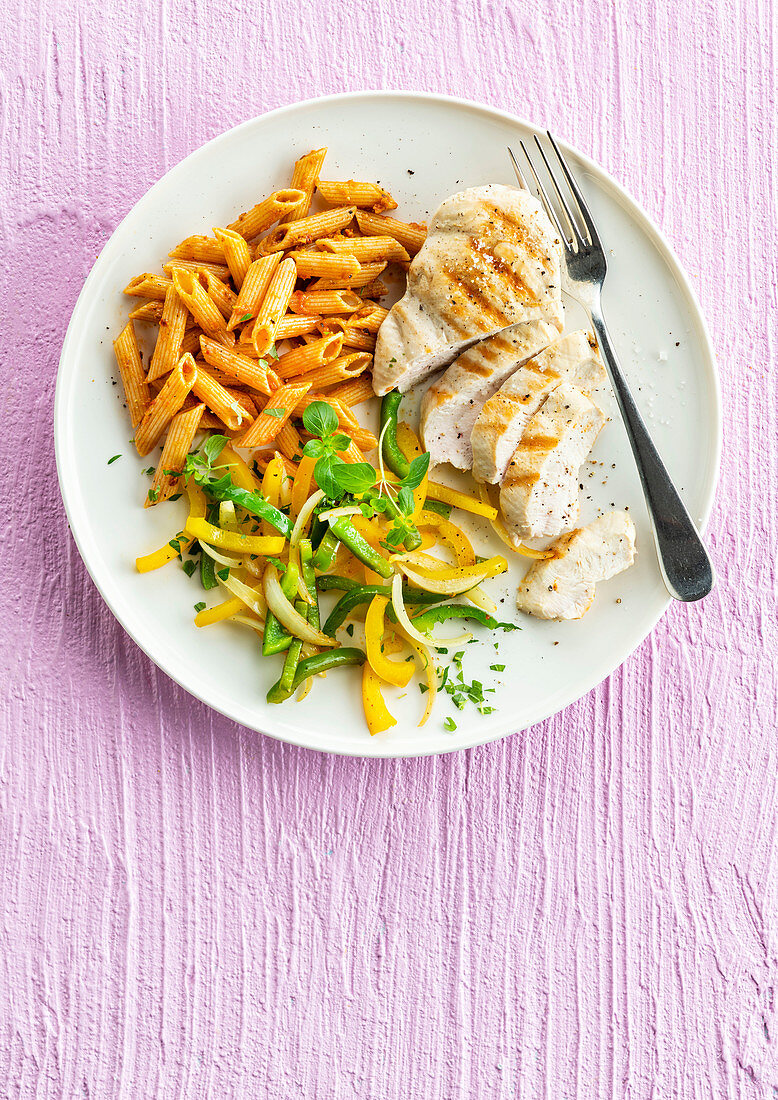 Grilled chicken breast with penne and paprika pesto rosso sauce