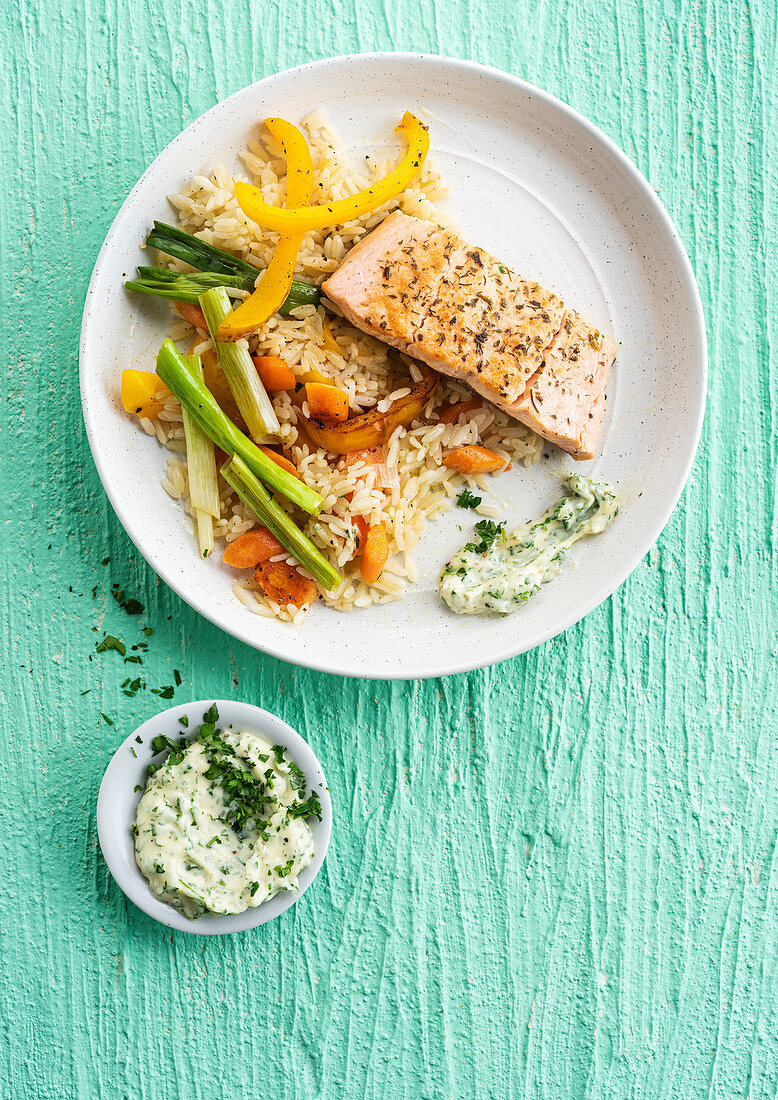 Salmon steak with rice and vegetables, herb mayonnaise sauce