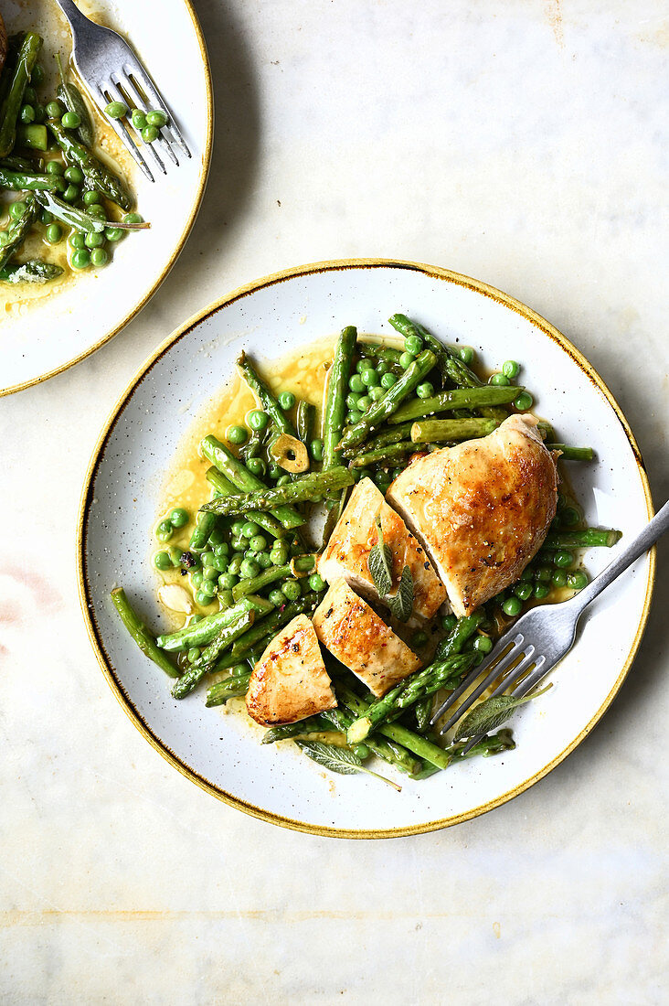 Chicken breast with green asparagus and fresh peas