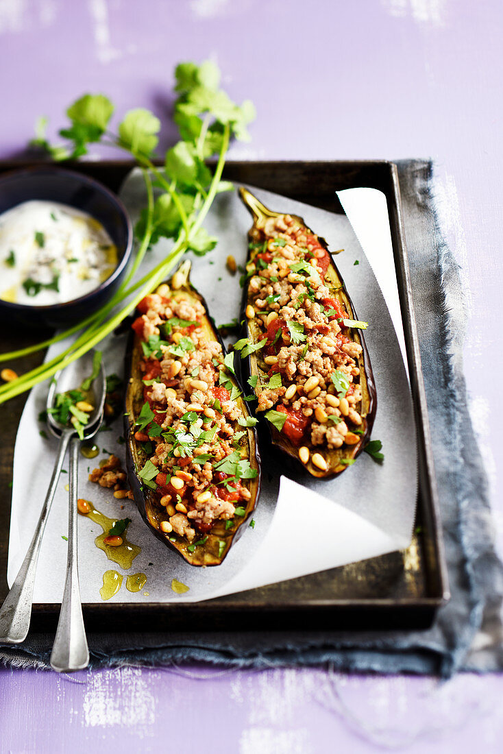 Grilled aubergines stuffed with ground veal,tomatoes,cumin,pine nuts and coriander,yogurt sauce