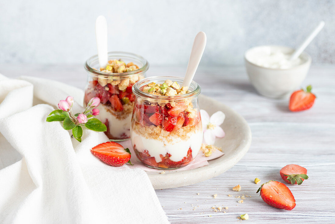 Layered desserts in glasses with strawberries and cream cheese