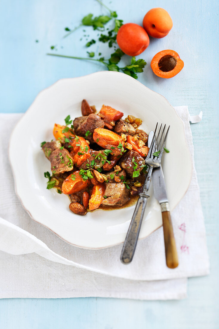 Pork with cinnamon,ginger,apricots,almonds and dried apricots