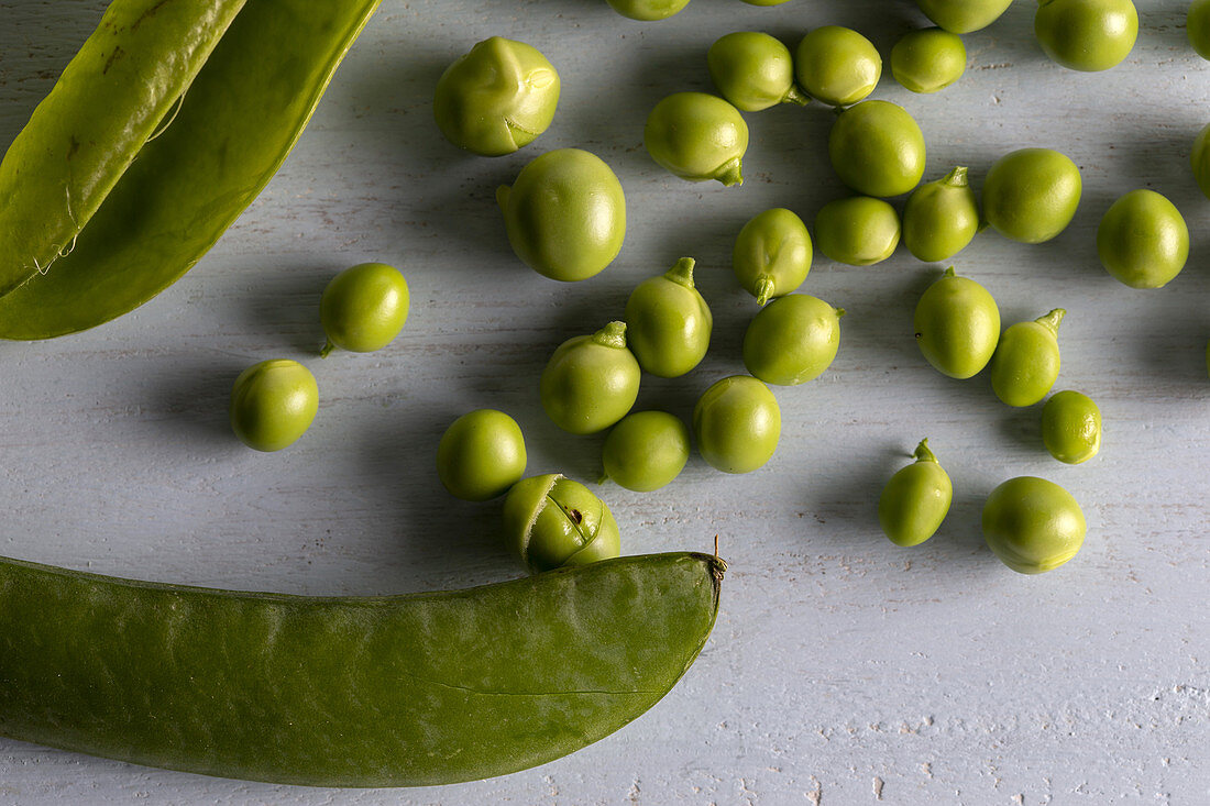 Close up shot of green peas and pods