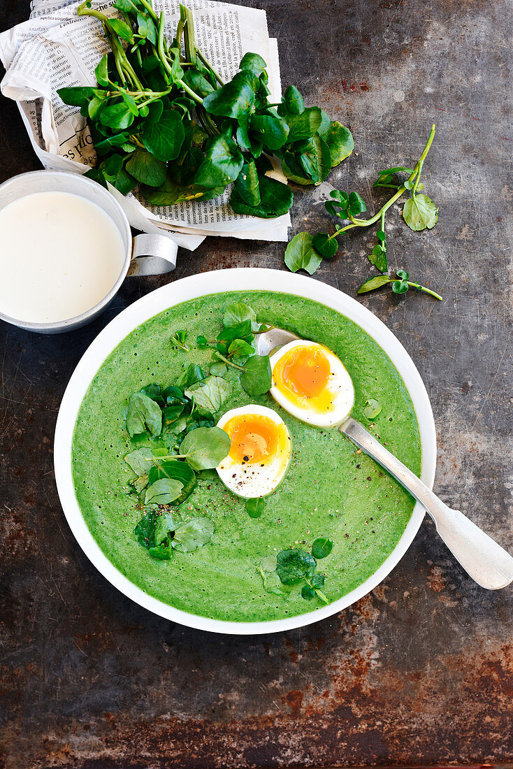 Watercress and potato soup with a poached egg
