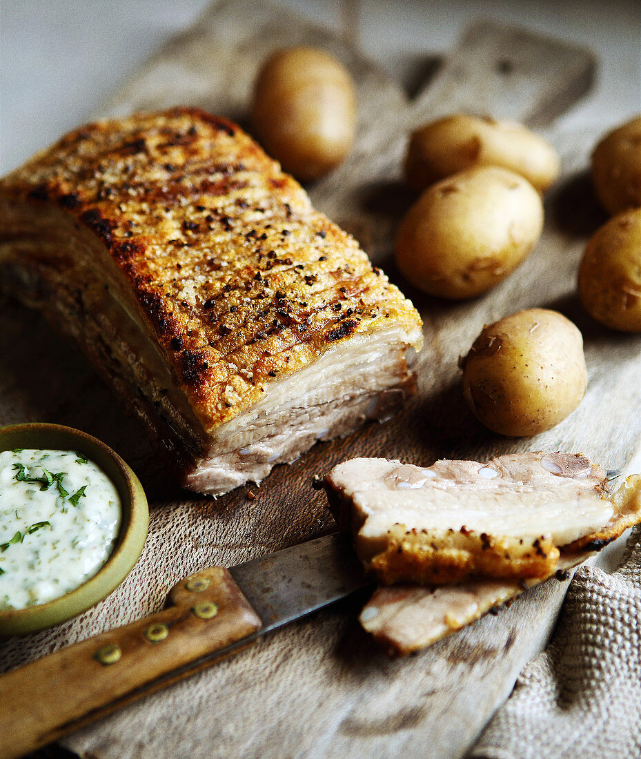 Pork breast with parsley sauce and potatoes
