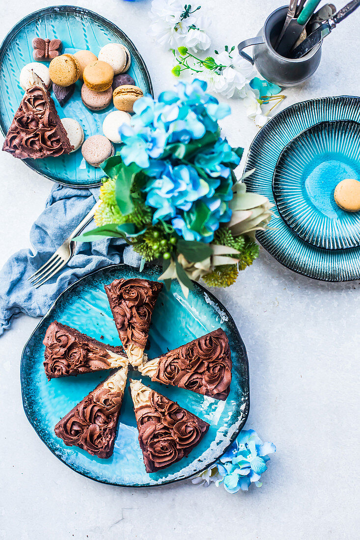 Soft chocolate cake and creamy icing rose petals