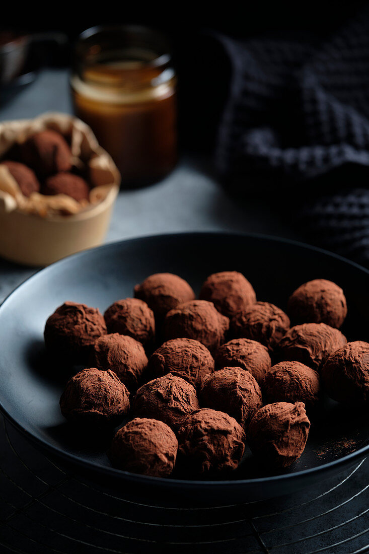Vegan dairy-free chocolate truffles, rolled in melted chocolate and dusted with cocoa powder