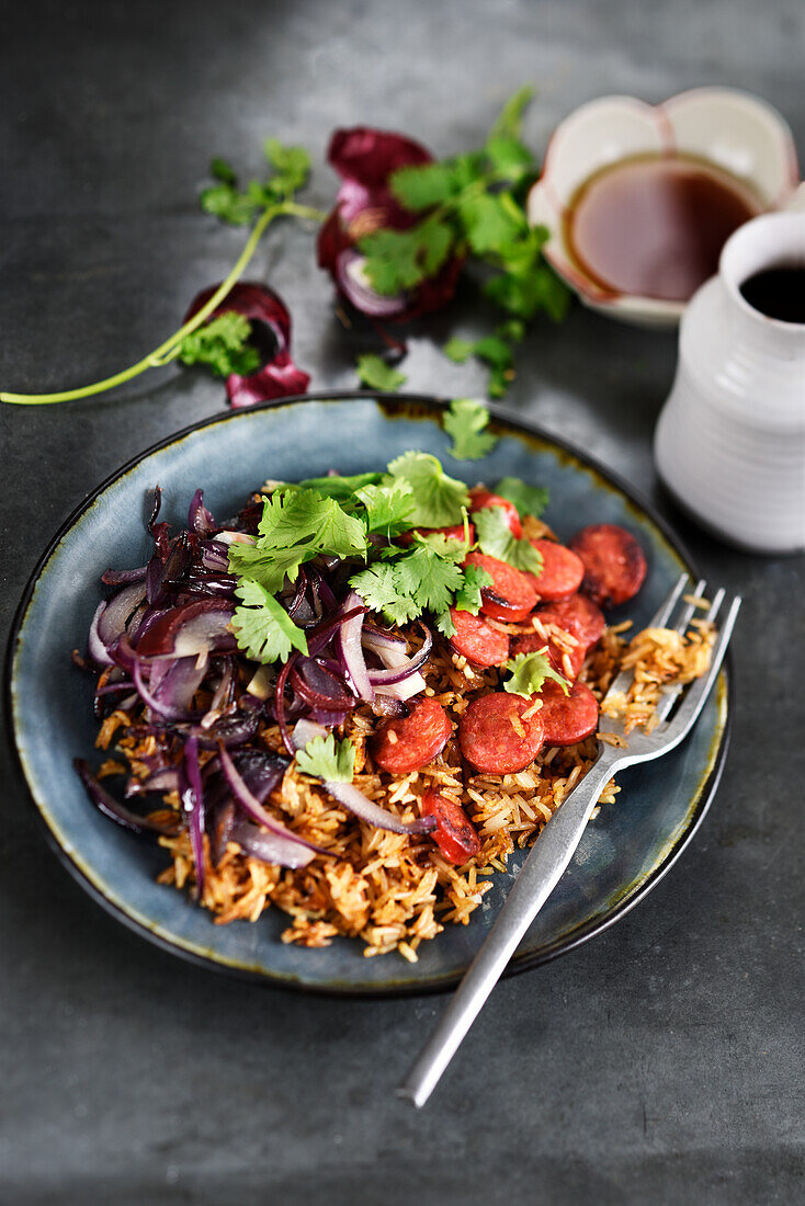 Stir fried rice with red onions and chorizo