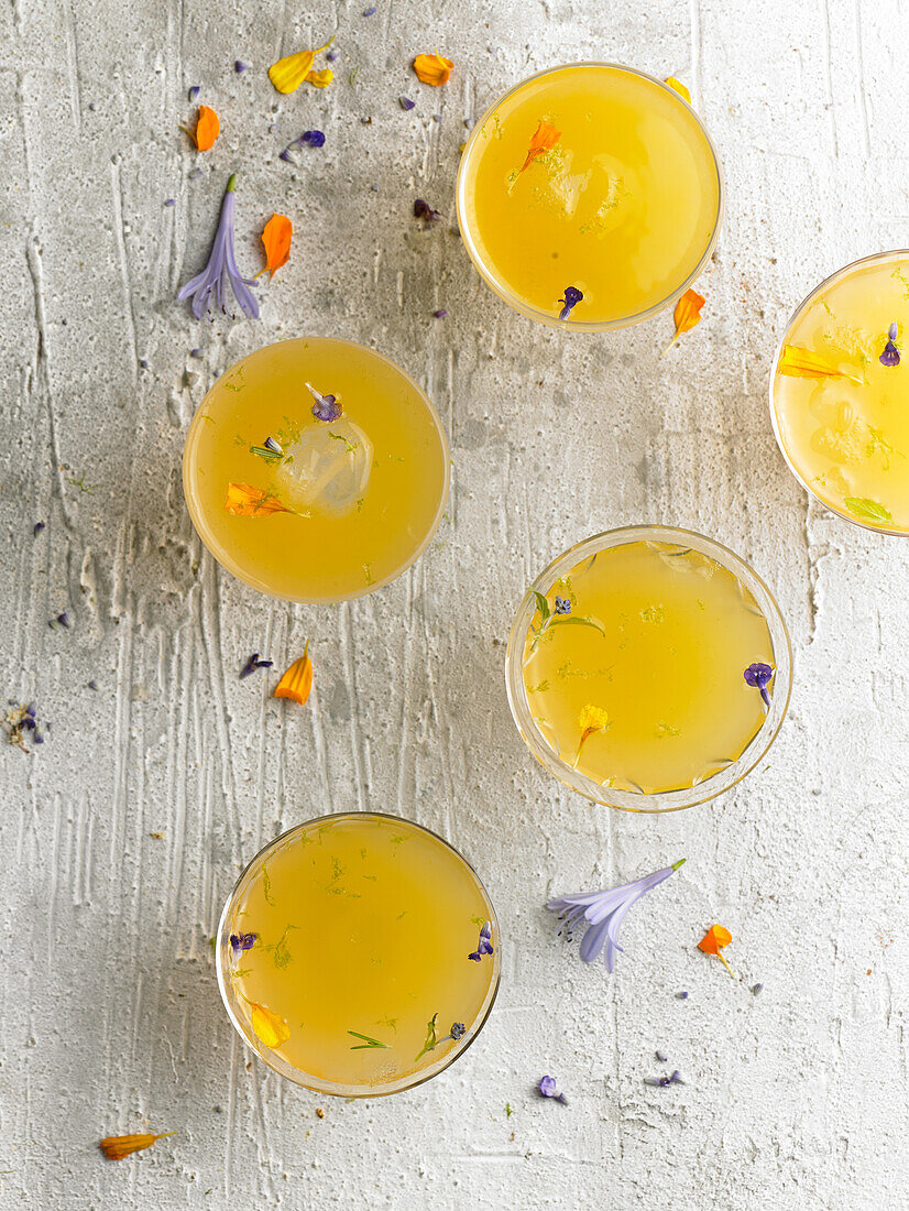 Summer cocktail with flower petals