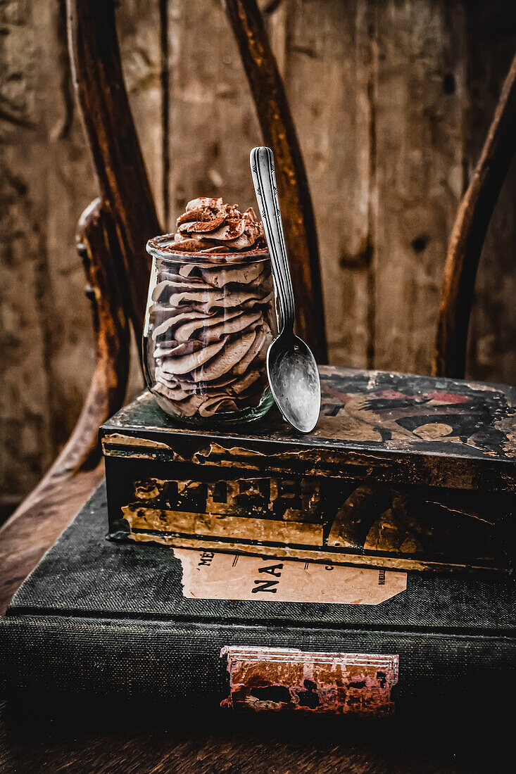 Baileys chocolate mousse on pile of old books