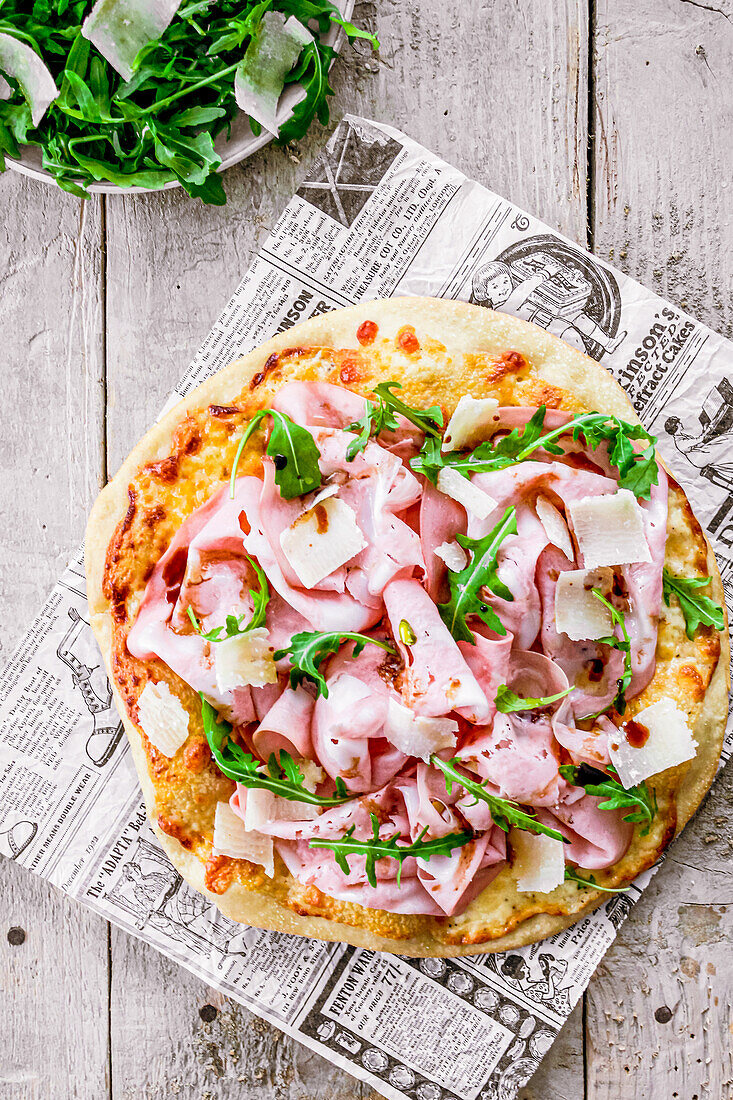 Pizza with mortadella and rocket