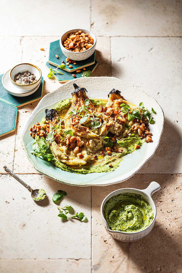 Grilled aubergines served with green tahini with herbs