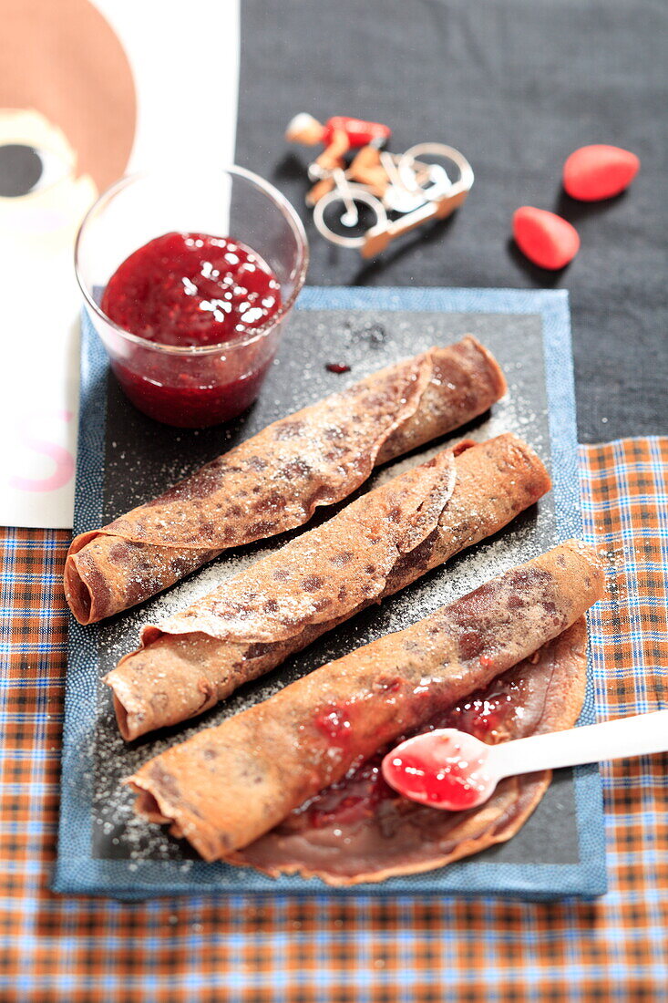 Chocolate crepes with strawberry jam
