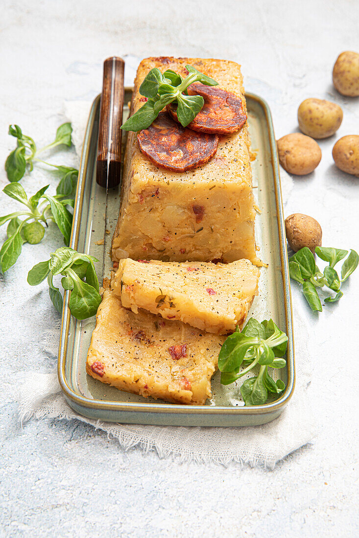 Terrine with two kinds of potatoes and chorizo