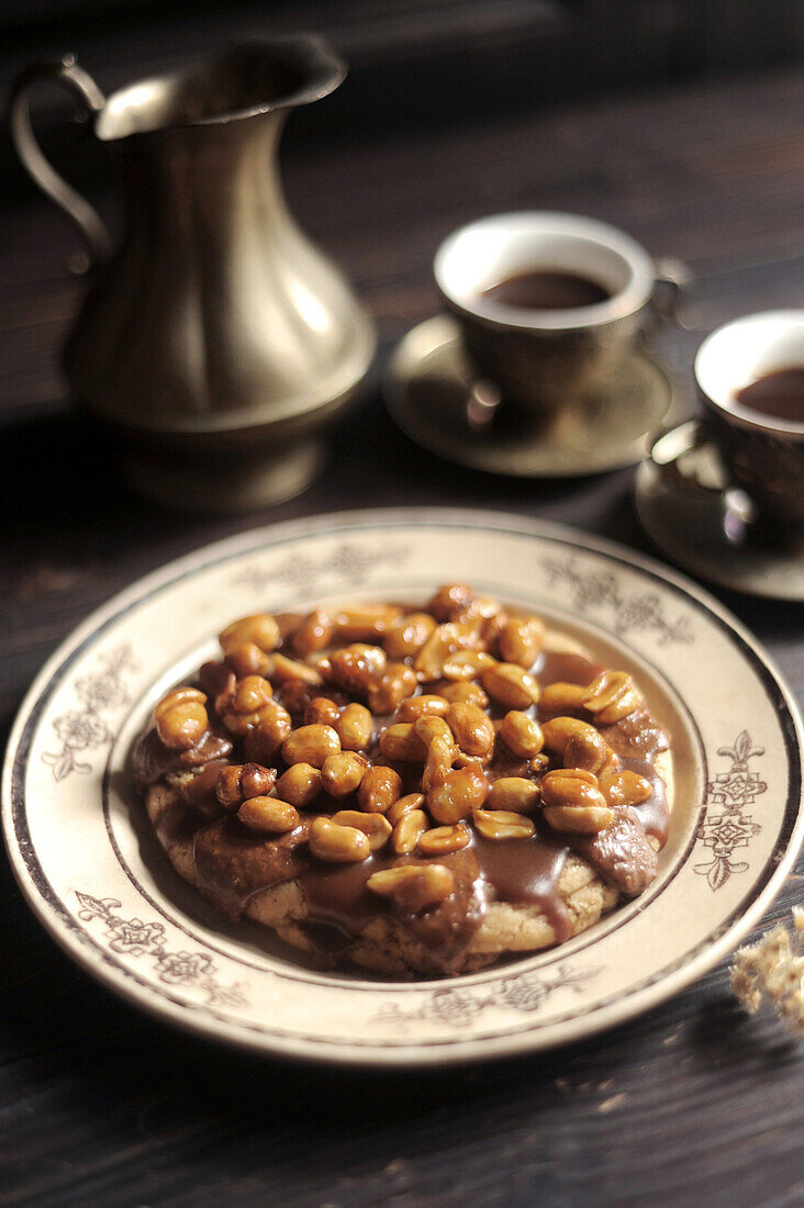 Giant cookie with melted chocolate and peanuts