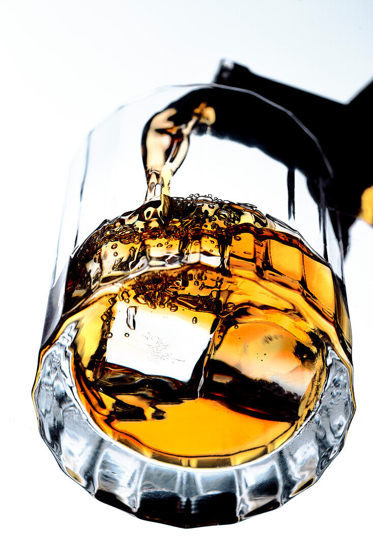 Whisky pouring into glass (Close Up)