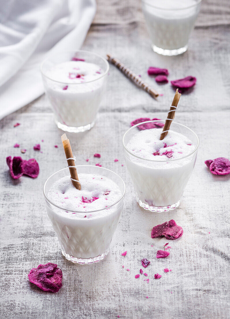 Indian lassi with candied violet blossoms