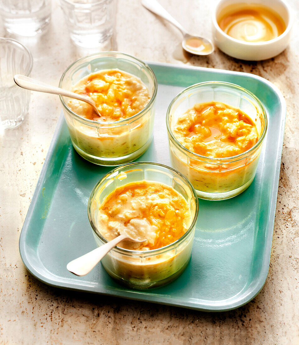 Rice pudding in glasses with caramel sauce