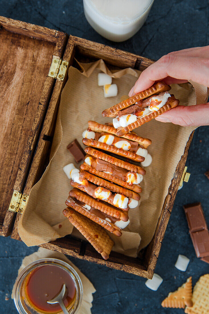 Sandwich cookies with marshmallow, milk chocolate and caramel