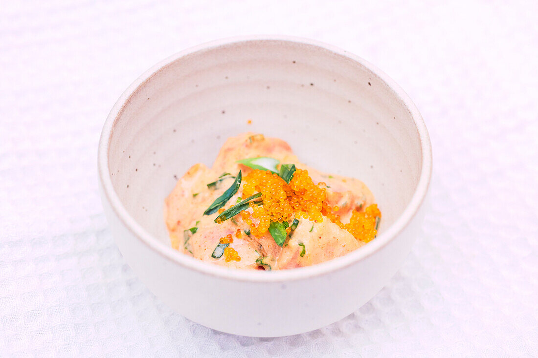 Salmon ceviche with flying fish roe and chives