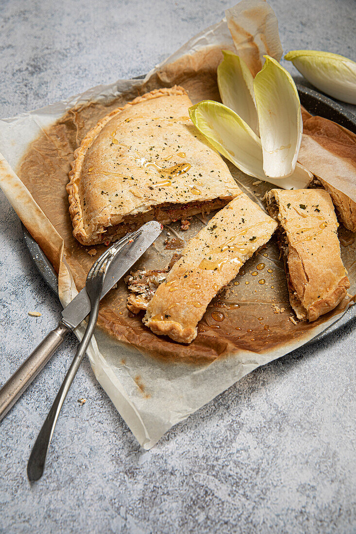 Calzone-style tart with chicory, celeriac, herbs, cheese and honey