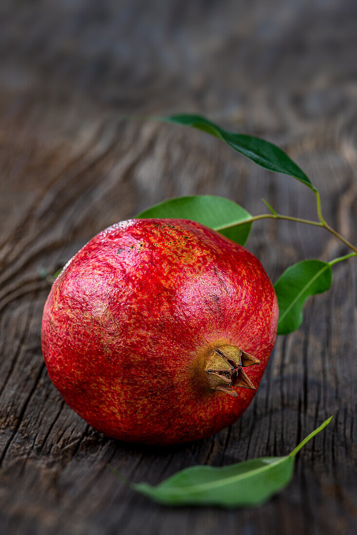 A pomegranate on a wooden background