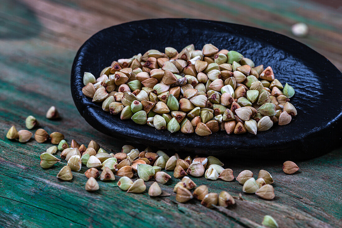 Buckwheat on a wooden spoon