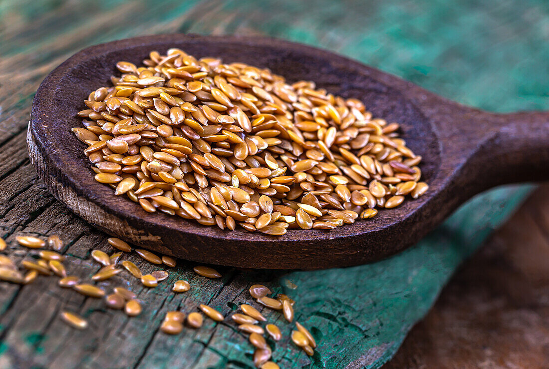 Flaxseed on a wooden spoon