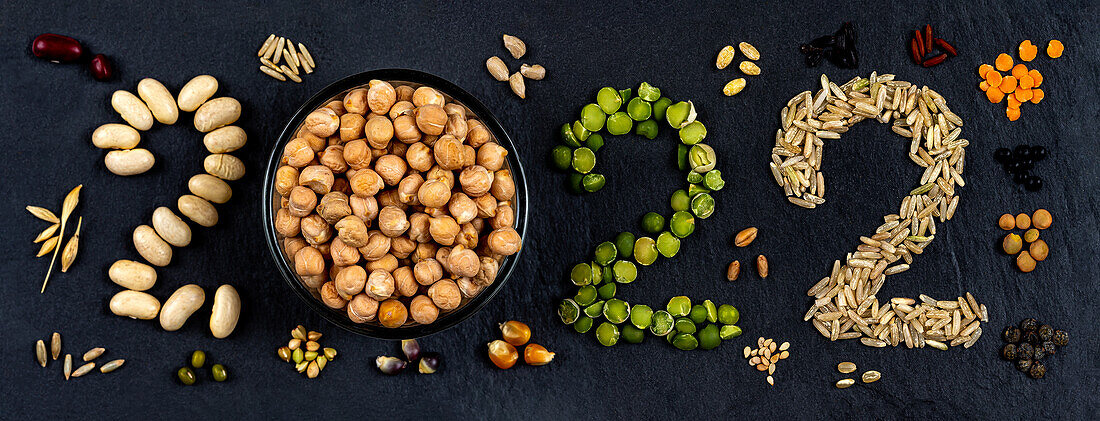 2022 made from legumes and rice on a black background