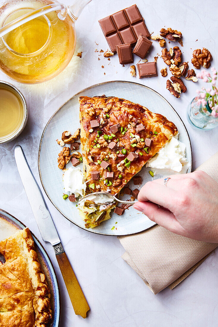 Chocolate,praline,walnut and pistachio Galette des rois with whipped cream