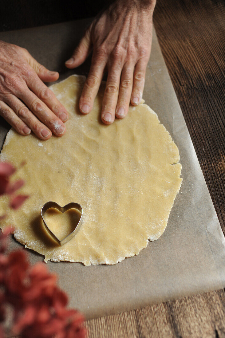 Preparing heart-shaped biscuits