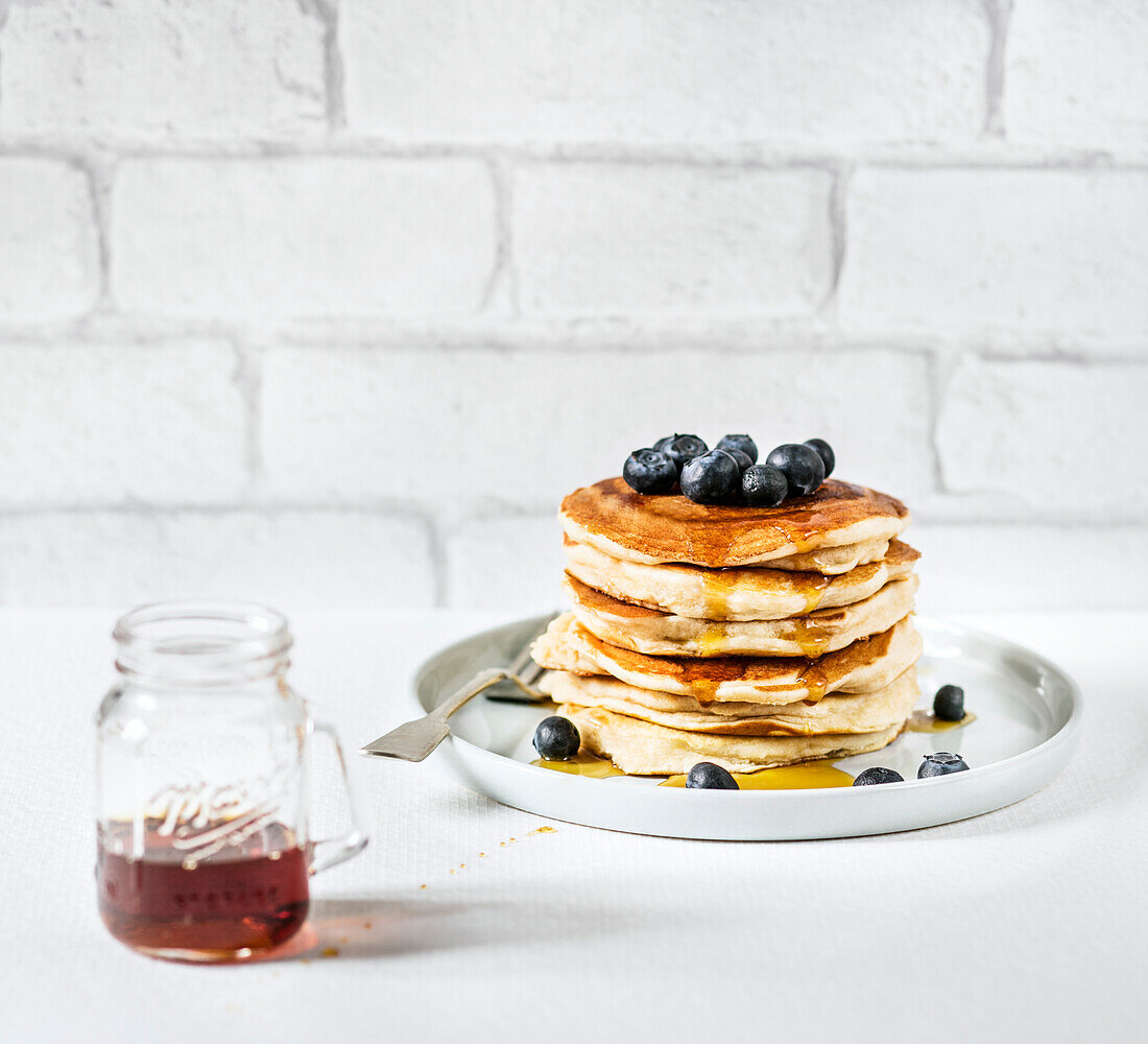 Pancakes with blueberries and maple syrup