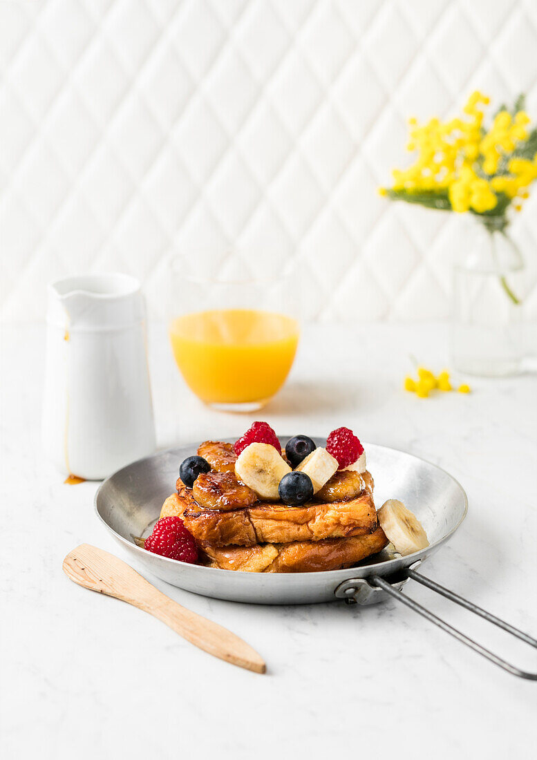 French toast with banana and berries