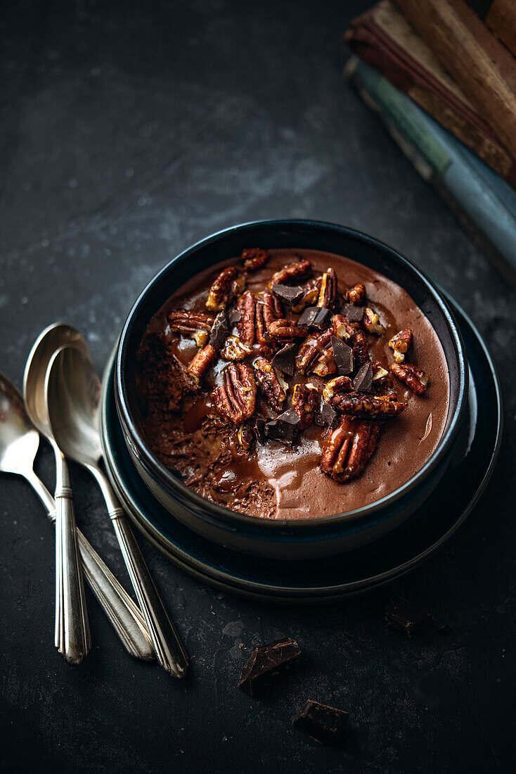 Chocolate mousse with caramel and pecan nuts