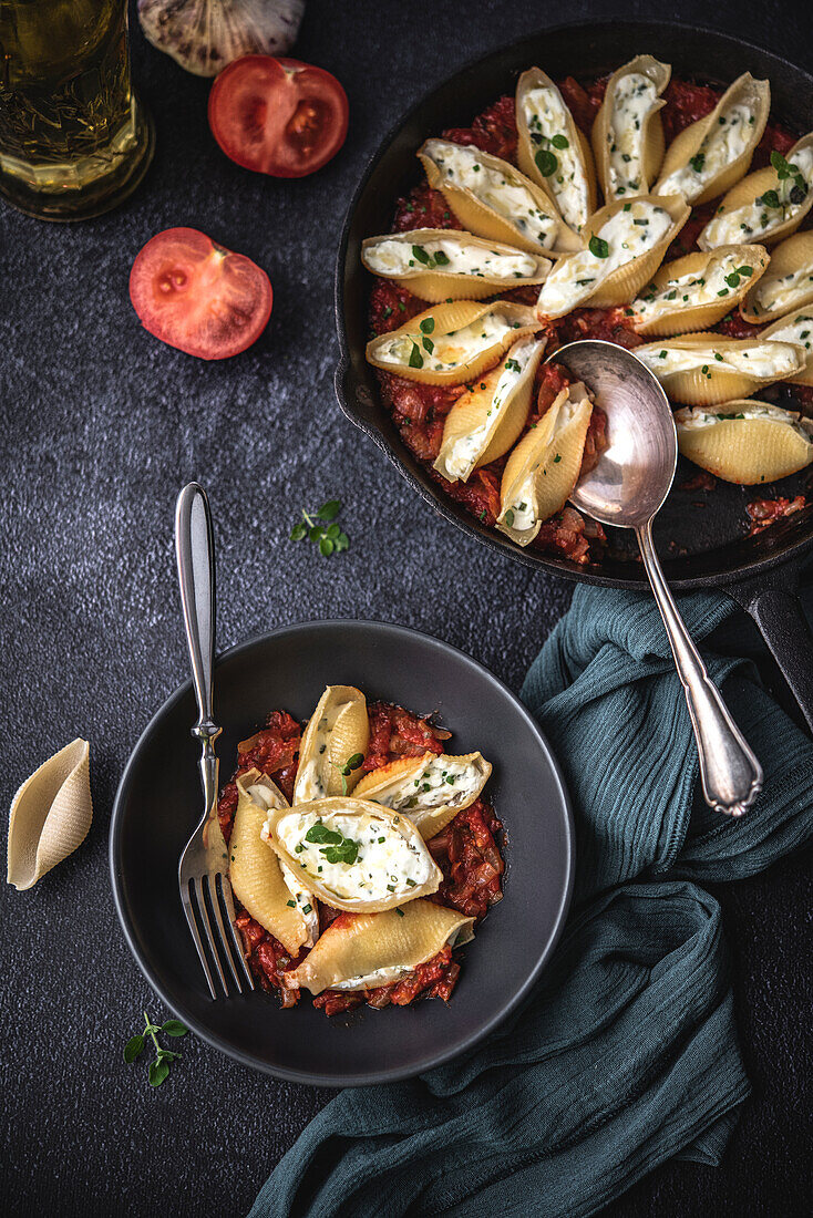 Filled pasta with cream cheese on tomato sauce